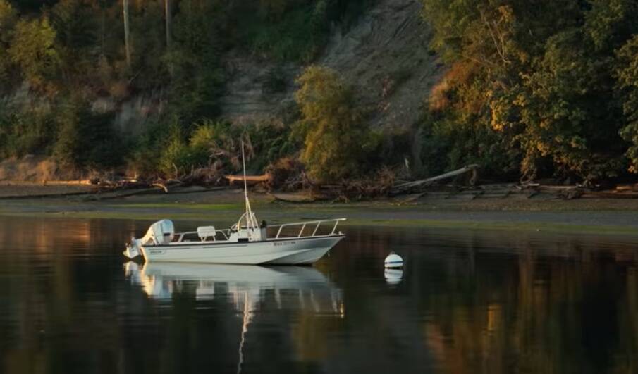 Photo from A War With Time, the acoustic music video on Youtube
A boat sits peacfully in the salish sea.