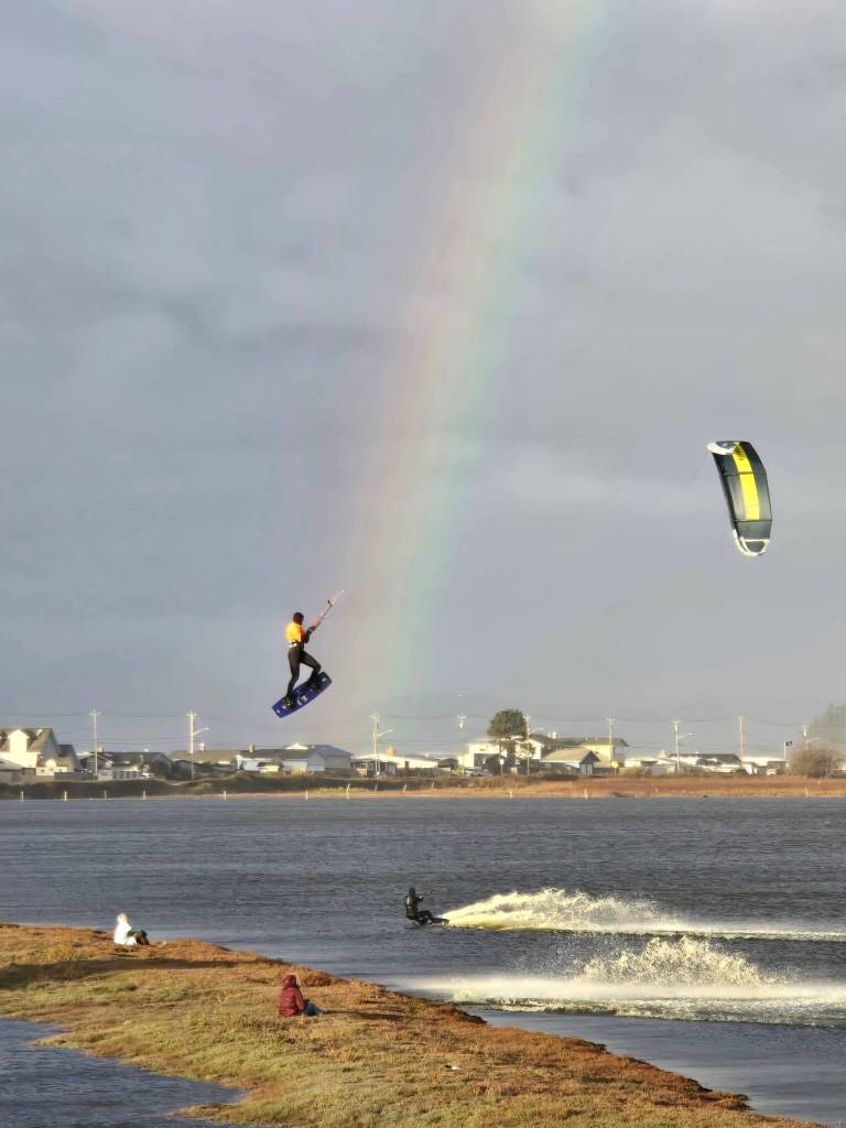 (Photo by Nichol Redfearin) Kiteboarders enjoy a beautiful day on Whidbey Island.