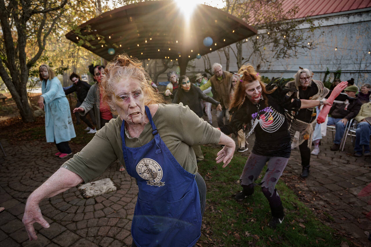 File photo by David Welton
Zombies in 2023's flash mob strike a spooky pose.