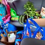 Krista Vanicsek loads her car up with produce for the food pantry. (Photo provided)