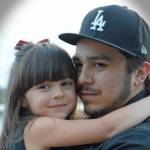 Garcia hold his daughter, Sophia.