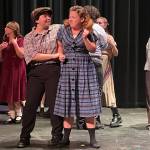 Photo by Marina Blatt. Oak Harbor High School students act in Badger. On stage, a woman gets assaulted at a dance.