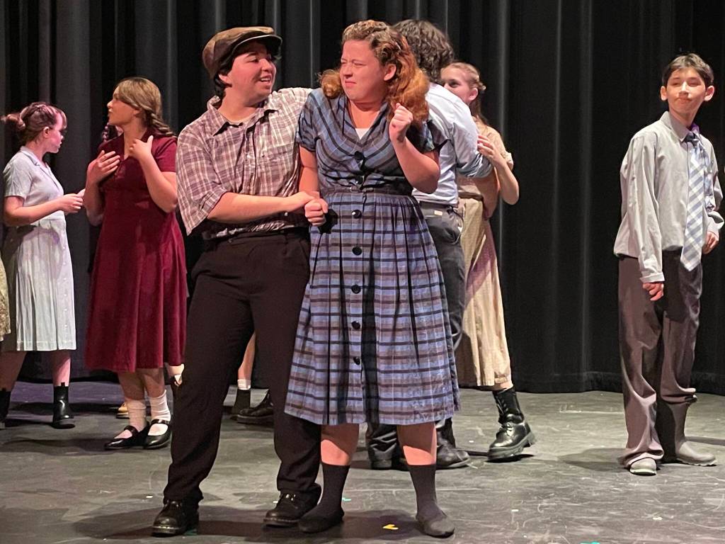 Photo by Marina Blatt. Oak Harbor High School students act in Badger. On stage, a woman gets assaulted at a dance.