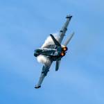 Photo by Joe A. Kunzler
Vapor forms of an EA-18G Growler as it streaks through blue skies.