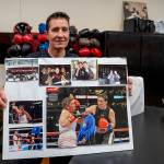Dakota Stone holds up a board of photos cut from magazines featuring her fight with Christy Martin. (Photo by David Welton)