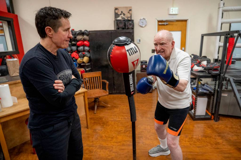 Bob Merry warms up while Dakota Stone looks on. (Photo by David Welton)