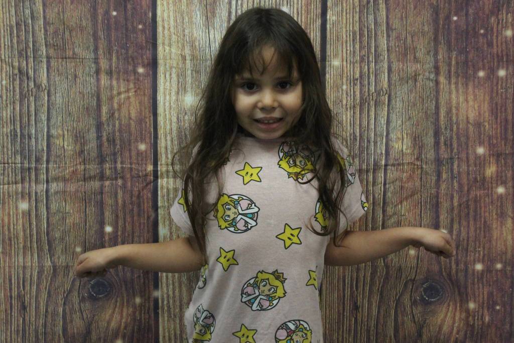 Ellie, age 4, is thankful for princesses, she said, before performing a plié in her imaginary princess dress.