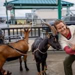 (Photo by David Welton) A passerby cheeses for a selfie with Loki while Stilly acts camera-shy.