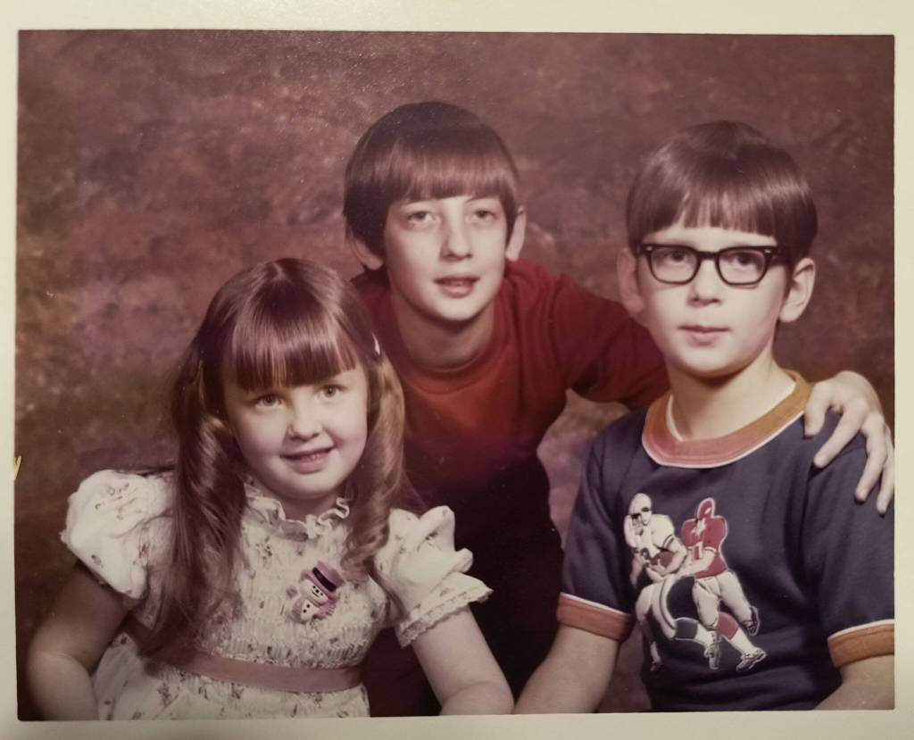 Cheryl Rafert, Jon Larson and Jeff Pangburn pose for a family photo.