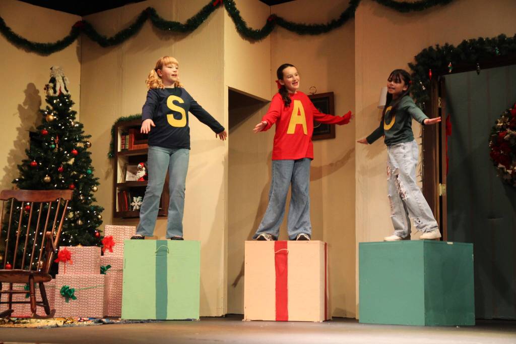 From left, Soirse Burke, Addie Horrobin and Olivia Sto Thomas perform a rendition of Chrsitmas Dont Be Late, from Alvin and the Chipmunks.