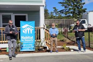 From left: Orin Kolaitis - CEO, Scott Givens – Chief Program Officer, Mayor Ronnie Wright – Oak Harbor at a home dedication. Photo courtesy Habitat for Humanity of Island County