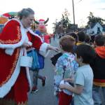 Photo by Marina Blatt
Mrs. Claus hands out candy to eager kids at the Coupeville parade on Dec. 6.
