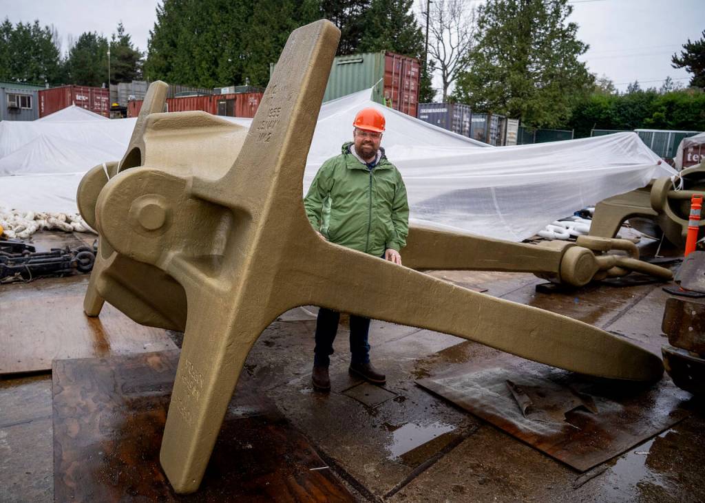 Senior Recruiter Dane Douglas stands by a massive anchor. Most boats the shipbuilder works on average between 150 and 200 feet long  though some boats are up to 350 feet.