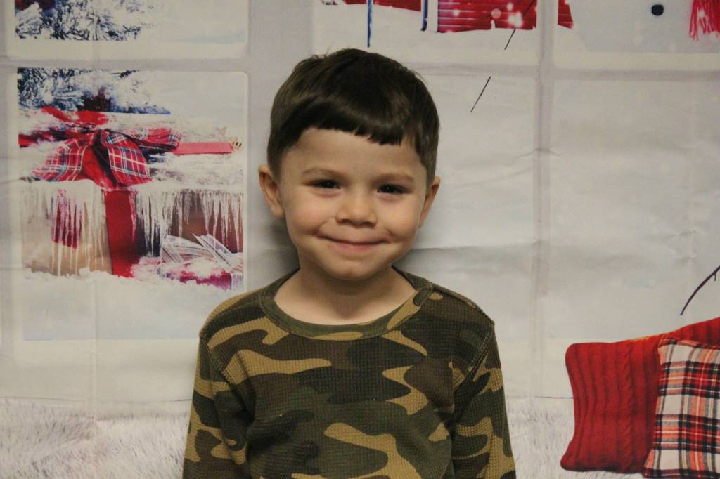 (Photo by Marina Blatt) Benjamin Espy, age four, wants a Spider-Man puzzle, which seems to be all the rage right now among preschoolers.