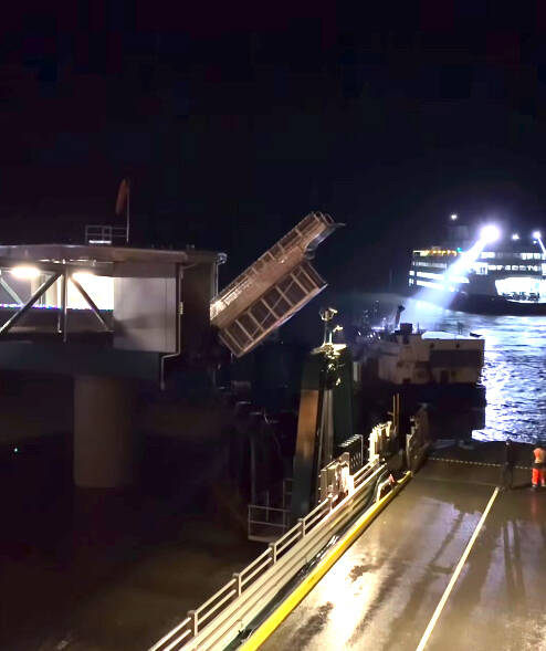 (Photo by the Washington State Ferries) Tokitae, the ferry, approach the dock slowly through the dark, guided by its two flood lights on, until the ghost vessel drifted out of the way.