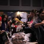 (Photo by Allyson Ballard) More than 100 volunteers gathered at Life Church Thursday evening to assemble grocery bags full of food for families in need.
