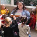 (Photo by Marina Blatt) A teacher reads to her preschool class at the Nurture With Care Kids Academy. The flexible drop-in program offers kid-free time for busy parents who need to make appointments, run errands, take self-care days and attend meetings.