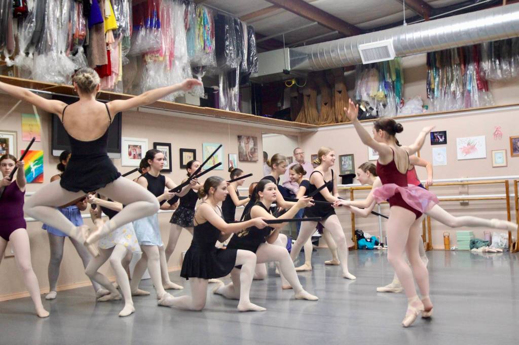 A battle unfolds as dancers play-fight.