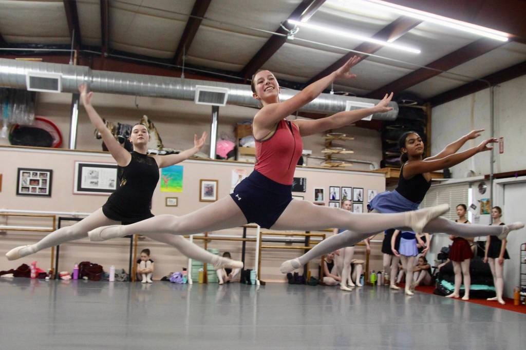 From left are Aimee Brinlee, age 15, Riley White, age 16 and Daniella Ramos, age 13, dancing in the Waltz of the Flowers.