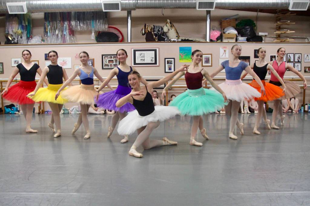 Dancers fan out in colorful tutus behind Tessa Lang, age 17, in the role of Sugar Plum Fairy.