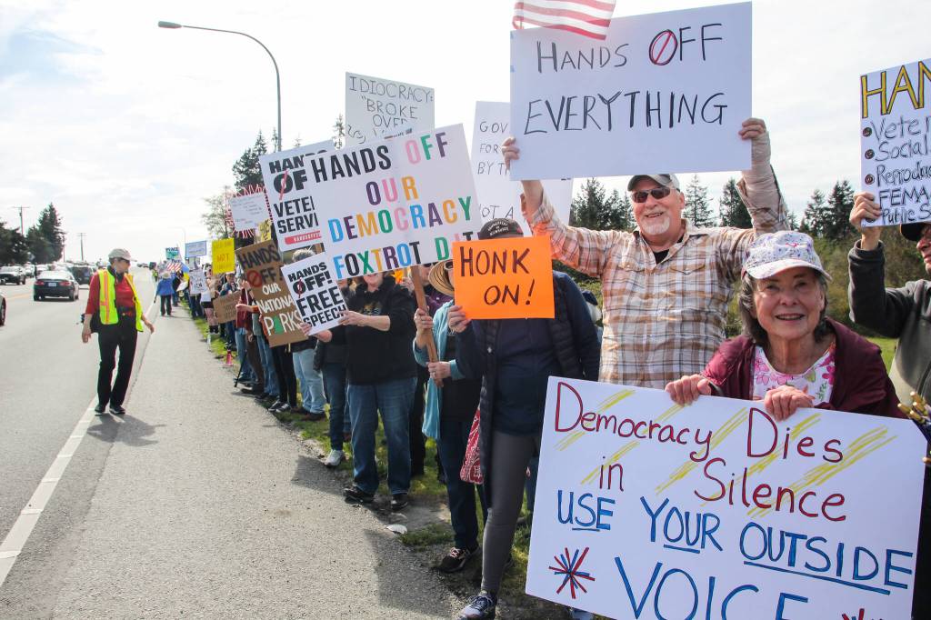 (Photo by Luisa Loi) About 1,500 people showed up in front of Oak Harbors Navy aircraft monument in April as part of a nationwide day of protest against the Trump administration.