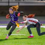 (Photos by Levi Evans, Oak Harbor High School Yearbook) Freshman Kenna Zwak runs the ball for the Wildcats in the teams game against Cascade on Wednesday.