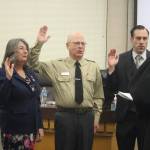 (Photo by Marina Blatt) From left, Barabara Armes, Sandi Peterson, James Marrow and Bryan Stucky swore an oath of office on Tuesday.