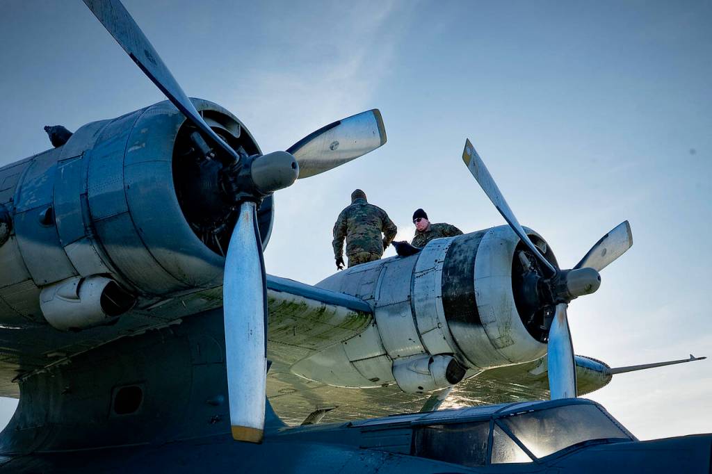 (Photo by David Welton) The Washington Army National Guard Chinook helicopter sling-loaded the PBY and doubled the length of the main cable carrying it from 150 feet on Tuesday to 300 feet on Wednesday.