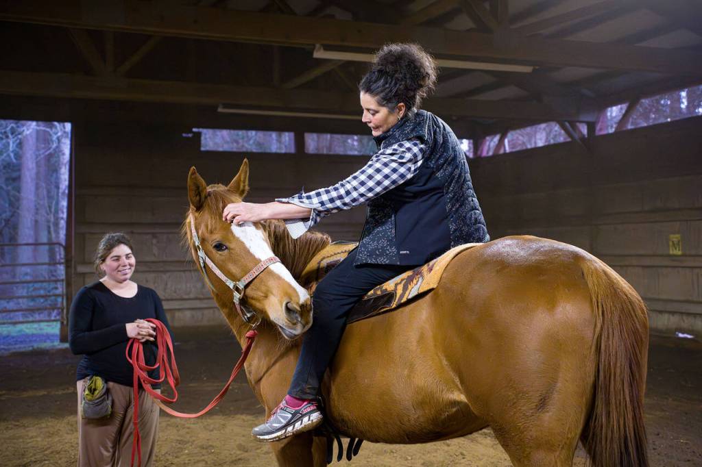 (Photo by David Welton) Jane Beau pets Gal and thanks her for the ride. Andrews stressed the importance of creating harmony with the horse as an equestrian vaulter.