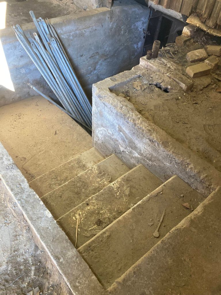 Photo provided by David Stern. The hidden staircase leading down to the antique furnace.