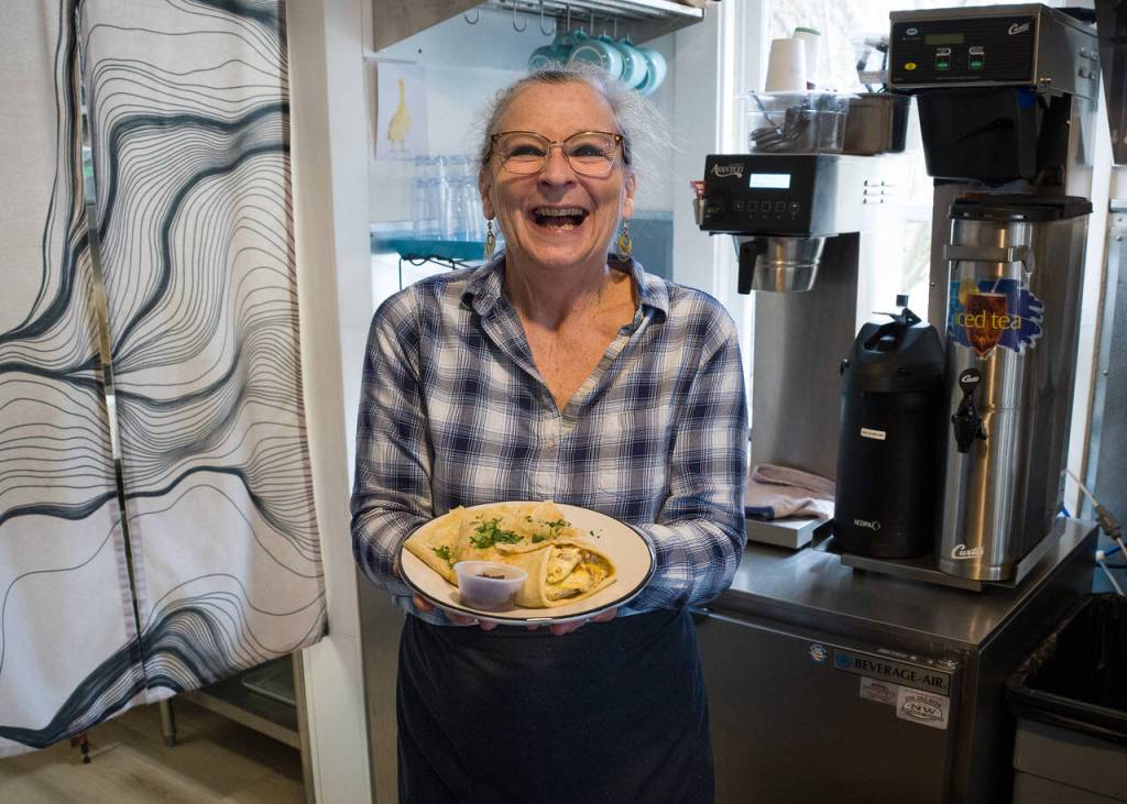 Photo by David Welton. Nicola Alevisos serves up a savory crepe.