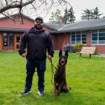 Official Navy photo by GM1 Joseph Martinez. Freddy will spend retirement with his new owner Miguel Romero, a Department of the Navy Police K9 handler, pictured here.