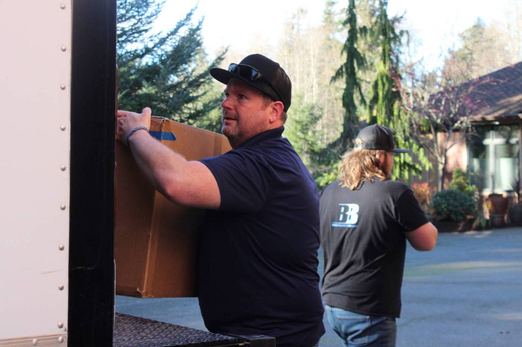 Photos by Allyson Ballard. Backbreakers NW founder Jeff Hansen, pictured in the foreground here, is a Coupeville native and the founder of the Freeland-based moving and junk removal company.