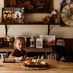 Photo by Jackleen Leed. The books goal is not just to photograph cats, but to tell their stories in the places they inhabit: cozy homes, bustling bookstores, quiet shops and beyond. Jackleen Leed captured this picture of her son, Remy Christenson, in a fall-themed photoshoot with Bruja, the kitten.