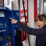 Photo by David Welton. Seattle resident Malia Keene was shocked by the gas prices in Clinton on Monday.