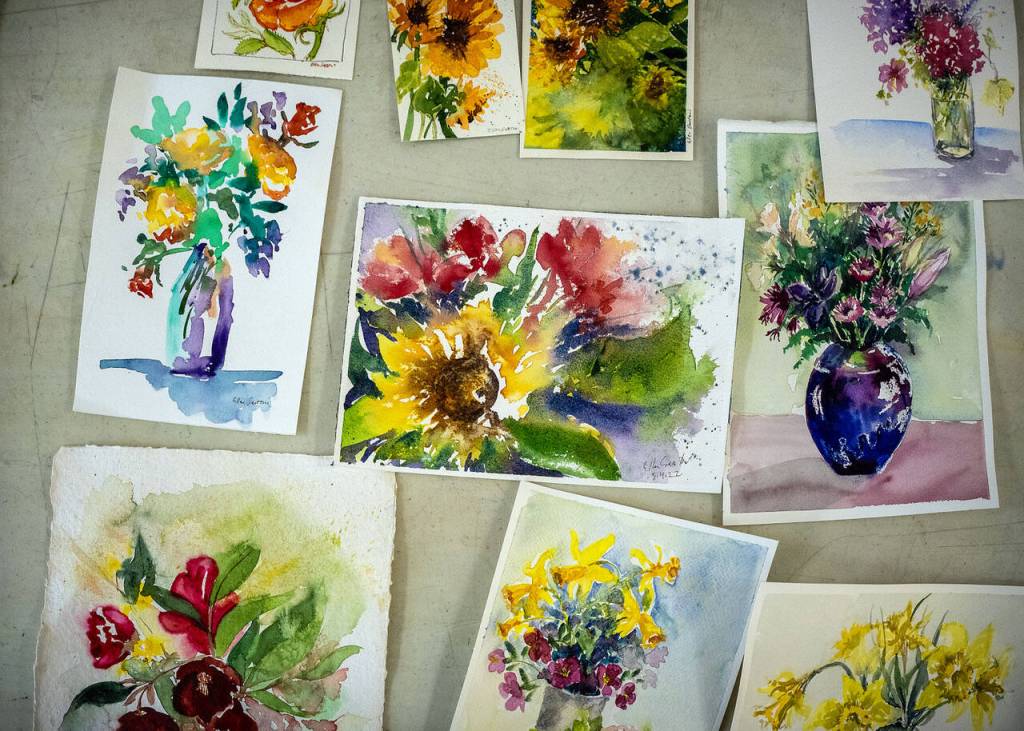 Photo by David Welton. Artists practiced painting flowers at a recent class at Create Space.