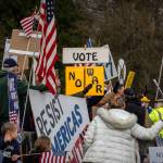 Photo by David Welton. Protests took place in North, Central and South Whidbey on Saturday.