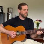 Josh Pinkston plays and sings a gentle tune at the end of the sound bath