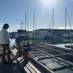 Photo by Allyson Ballard. Community members learned about rearing salmon and the legend behind the Coho salmons hooked nose at a recent feeding.