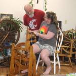 Photo by Marina Blatt. Carla McCoys connection to the spinning extends beyond organizing vendors. She loves working with wool and her husband, Jon McCoy, loves making the spinning wheels. Together, they are the perfect spinning team.