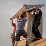 Photos by David Welton. Volunteers work on the finishing touches to the chapel.