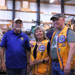 Photo by Allyson Ballard. Club members Rick Walti, Deanna Rogers and Gary Youngs, are pictured here left to right and posing in one of their secret garage sale storage locations.