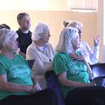 (Photo by Allyson Ballard) Members of United to Save Our Beautiful Town wore their green T-shirts to a town meeting last week.