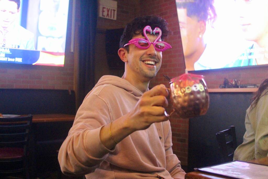 (Photo by Marina Blatt) Watching Love Island USA has always been something Nick Sanabria did at home. After wondering whether the show might be even more fun with company, he posted about the idea on Facebook. His plan to organize a watch party quickly took shape.