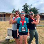 Photo provided
Khanor, Aleksia and Taygin Jump are in a good mood after finishing their run.